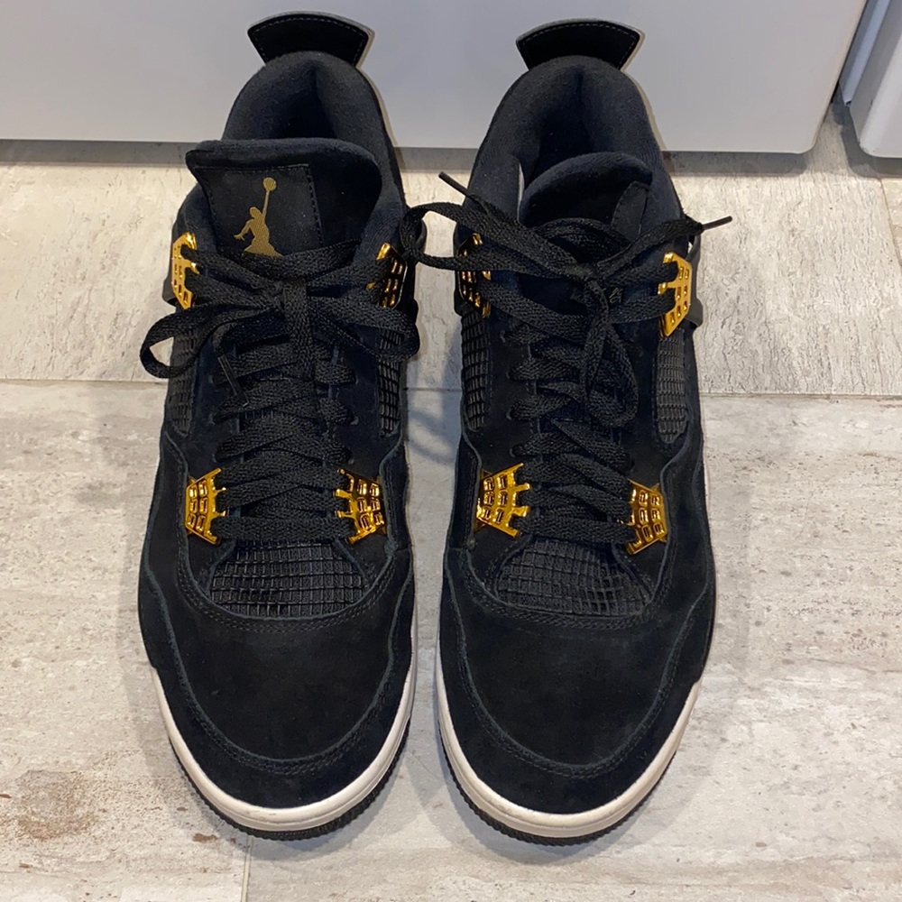 Black and gold Jordan 4’s